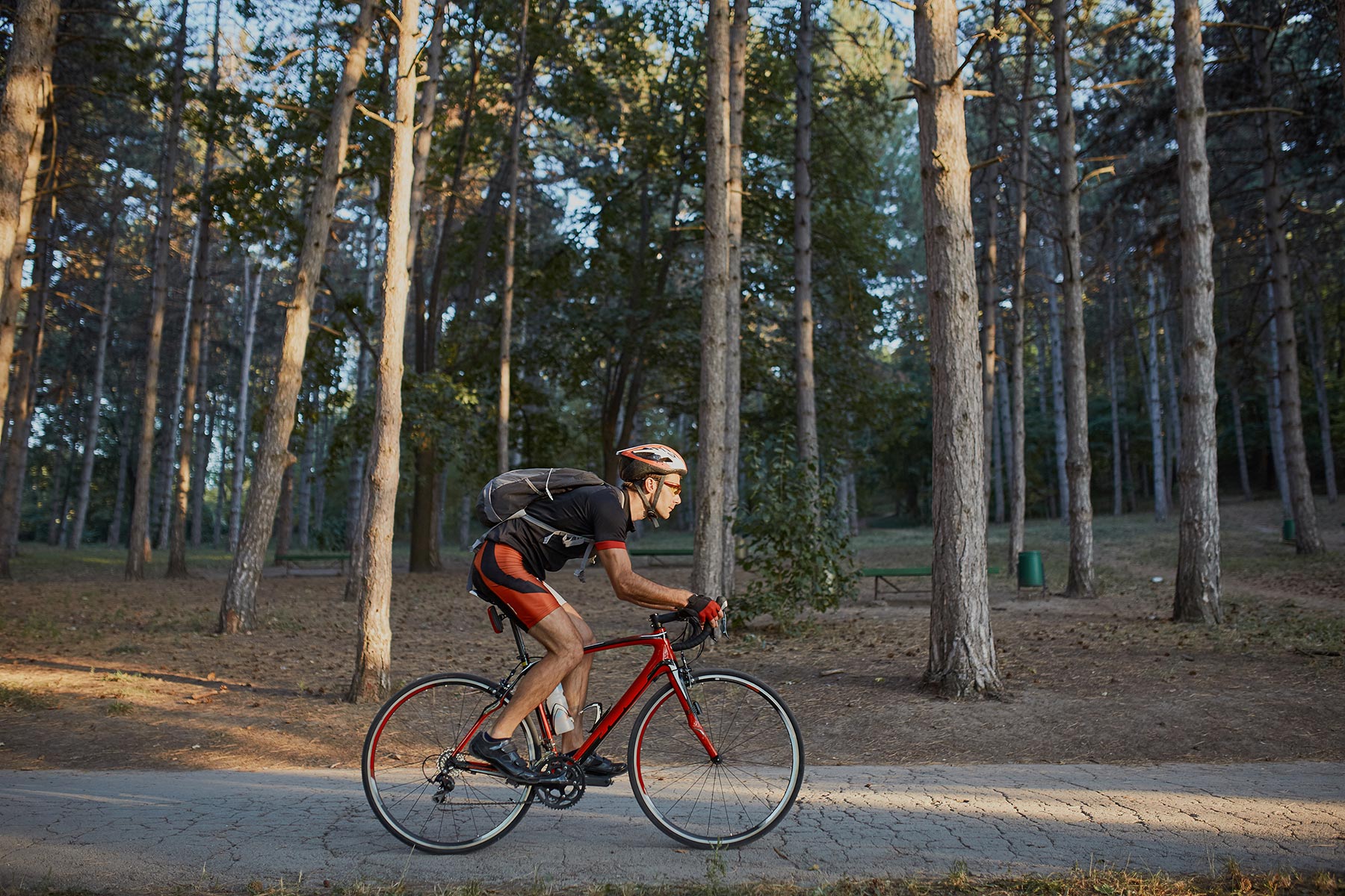 Young Man Are Cycling Road Bike In The Evening PTQXH5Q 1